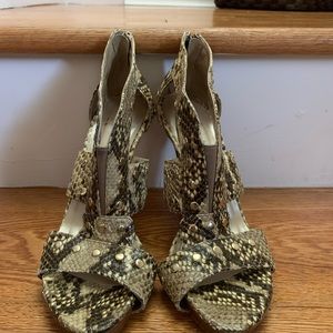 Stuart Weizmann snake pump sandals.